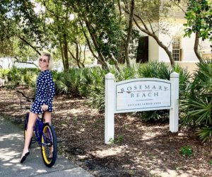 Biker Near Rosemary Beach Sign